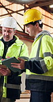 Carpenter, men and talk in workshop with tablet, training intern and problem solving for production. People, discussion and apprentice in factory with carpentry supervisor, manufacturing or planning.
