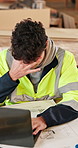 Headache, man and laptop in warehouse for woodwork, manufacturing error and contractor issue. Stress, production and carpenter person in joinery factory with tech for workshop, mistake or project