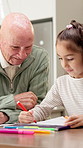Homework, grandfather and girl in kitchen with support, art project and help with homeschool task. Education, grandparent or kid with creative activity, family guidance or assistance in home learning