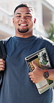 Face, student and laugh in university with book, higher education or study grant for business school. Happy, man and outdoor in college with textbook, scholarship and resources for commerce faculty.