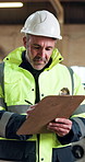 Man, architect and inspection with clipboard in warehouse for building material, inventory or stock. Male person, supervisor or inspector taking notes for checklist, safety check or quality control