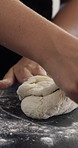 Knead, dough and hands of chef in kitchen at restaurant for pizza, bread or pastry recipe. Bakery, flour ingredient and culinary worker pressing batter for preparing food, meal or snack in diner.