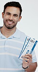 Happy man, studio and flight ticket for travel with airplane, transport and opportunity for holiday. Show, person and portrait on white background with boarding pass, itinerary and vacation giveaway