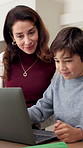 Mother, child and online education in house with laptop, homework and help for knowledge development. Woman, son and discussion in home with computer, problem solving or assistance for elearning task
