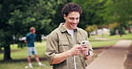 Student, man and laugh in university with phone, internet joke and funny online meme for education. Happy, person and typing outdoor in college with tech, reading text message and social media post.