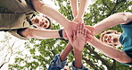 Below, students and hands together in university with support, education and environmental society. Happy, people and stack outdoor in college with learning, community and team building for eco club.